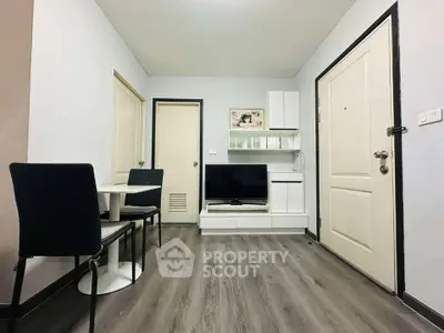 Modern living room with sleek furniture and stylish flooring, perfect for cozy gatherings.