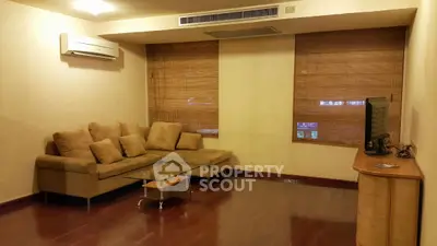 Cozy living room with sectional sofa and modern TV setup