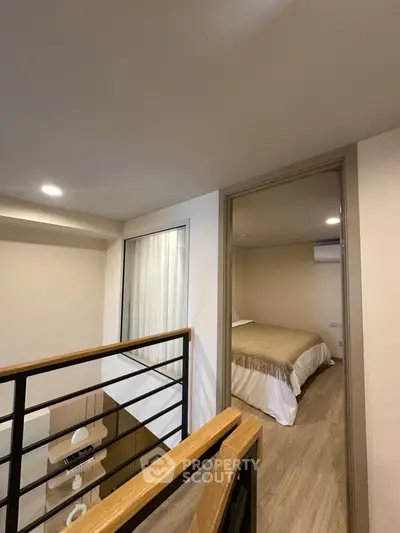 Modern duplex interior with cozy bedroom and stylish railing design