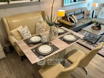 Stylish living room with elegant dining setup and cozy seating area
