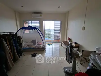 Spacious bedroom with balcony access and natural light