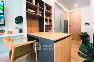 Modern kitchen with wooden cabinetry and sleek design in a stylish apartment.
