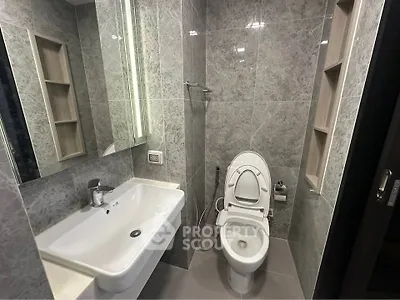 Modern bathroom with sleek design and elegant fixtures in a contemporary home.
