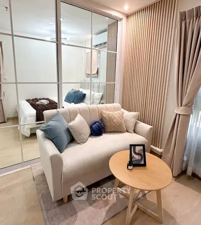 Modern living room with cozy sofa and stylish decor in a contemporary apartment.