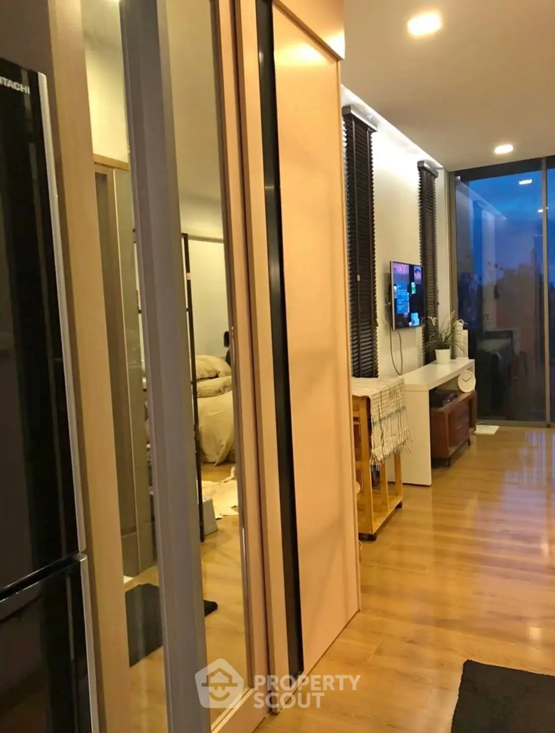 Modern apartment interior with sleek design and open layout, featuring a cozy living area and stylish decor.