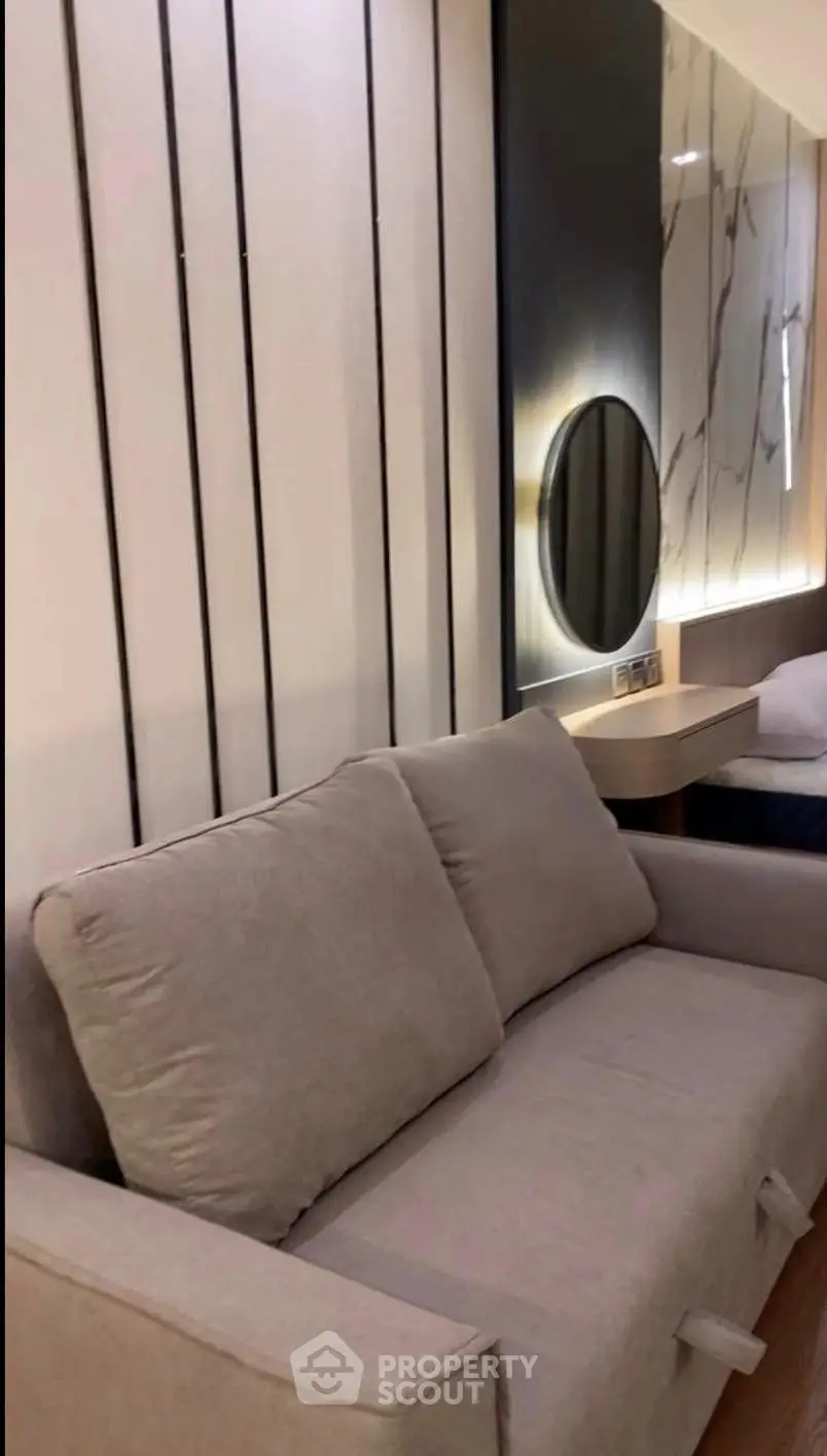 Modern living room with stylish sofa and elegant wall decor