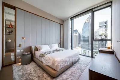 Luxurious bedroom with stunning city view and modern decor