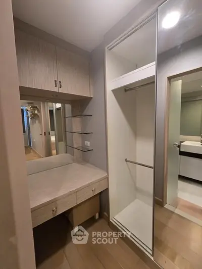 Modern walk-in closet with sleek design and ample storage space