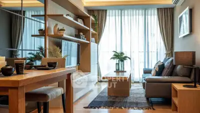Modern living room with elegant decor and large windows offering natural light.