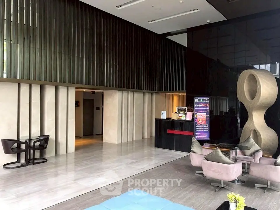 Luxurious modern lobby with sleek design and contemporary furniture in a high-end building.