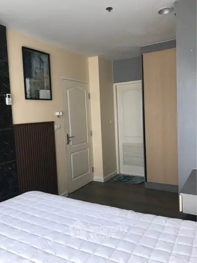 Cozy bedroom with modern decor and ample storage space