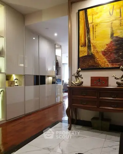 Elegant hallway with modern decor and artistic painting