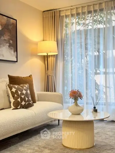 Elegant living room with modern decor and natural light