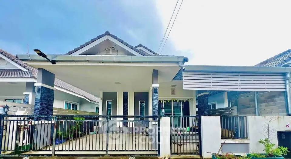 Charming single-story house with modern facade and spacious front porch.