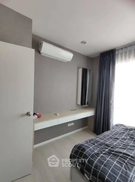 Modern bedroom with air conditioning and stylish decor