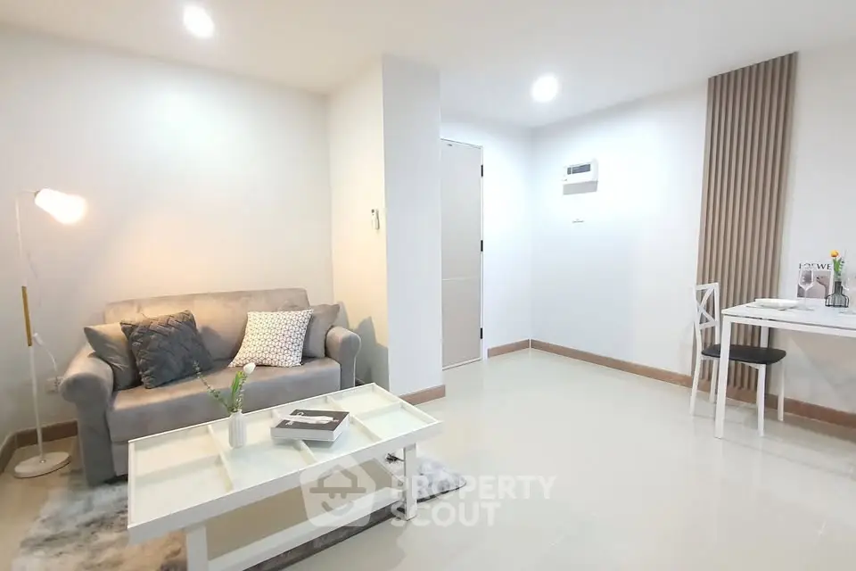 Modern living room with cozy sofa and stylish decor