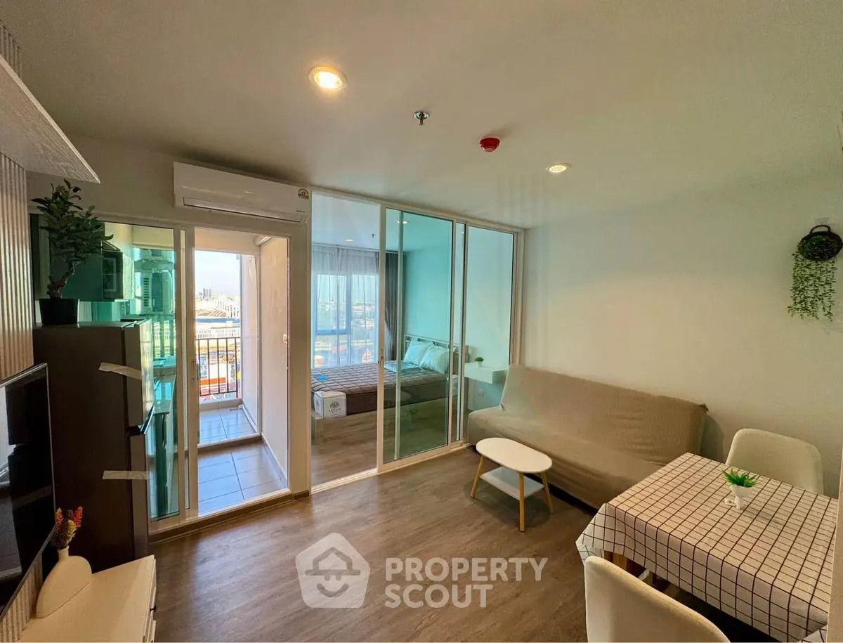 Modern open-plan living room with balcony view in a stylish apartment
