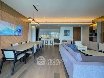 Spacious modern living room with open kitchen and elegant dining area