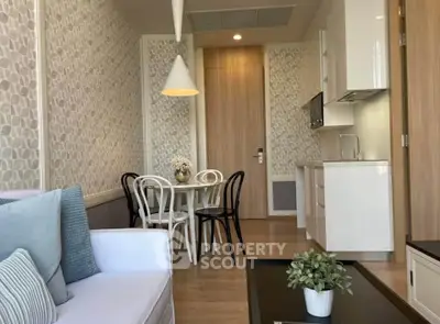 Chic modern living room with stylish decor and compact kitchen area, perfect for urban living.