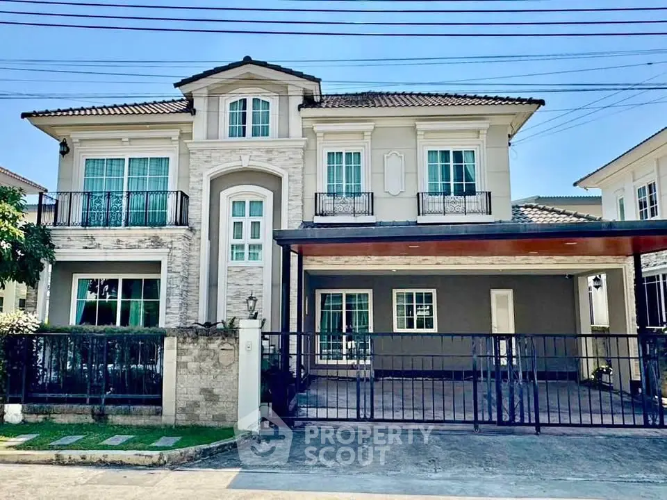Elegant two-story house with modern facade and spacious driveway in a serene neighborhood.