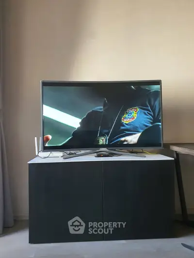 Modern living room with sleek TV setup on stylish cabinet