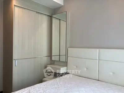 Modern bedroom with sleek wardrobe and minimalist design