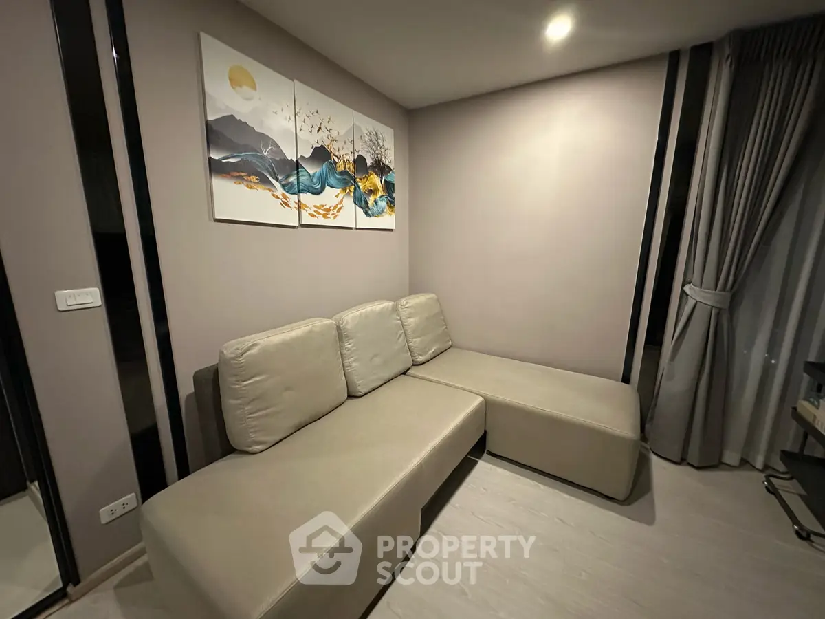 Modern living room with stylish sectional sofa and artistic wall decor