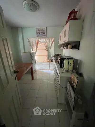 Cozy kitchen with open layout and modern appliances, perfect for culinary enthusiasts.