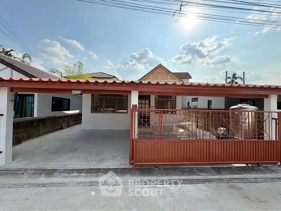 Charming single-story home with spacious driveway and modern exterior design.