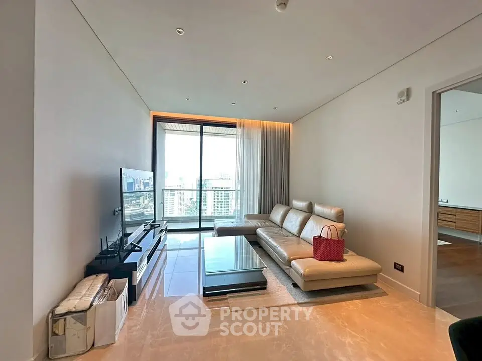 Luxurious modern living room with stunning city view and elegant furnishings.