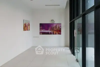 Spacious modern interior with large windows and vibrant artwork