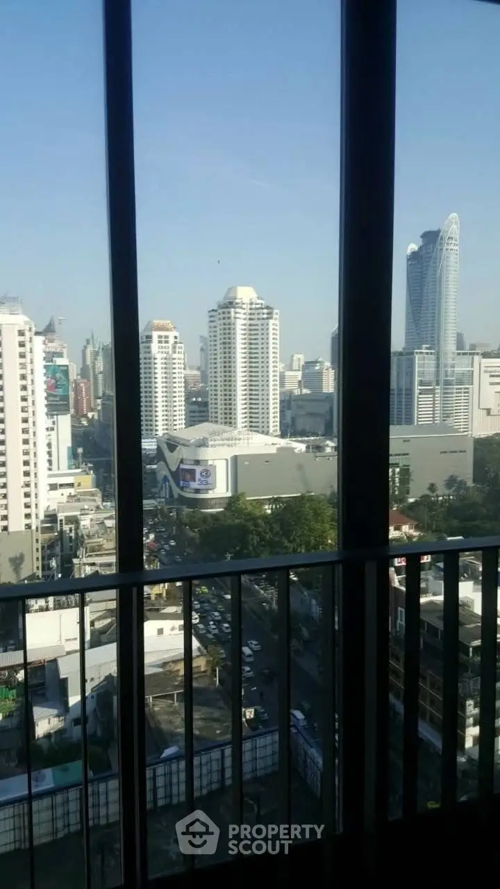 Stunning cityscape view from high-rise balcony with modern architecture