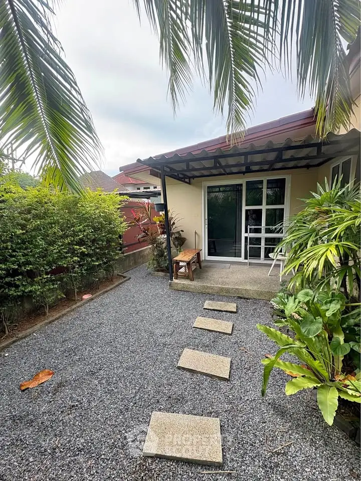 Charming garden view with patio and lush greenery in a cozy residential setting.
