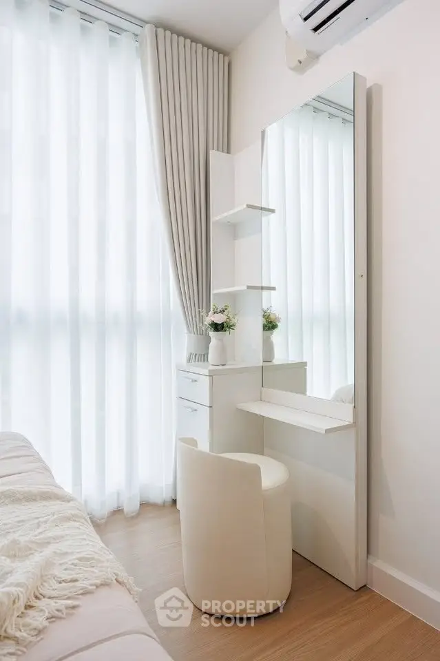 Elegant bedroom corner with vanity and natural light