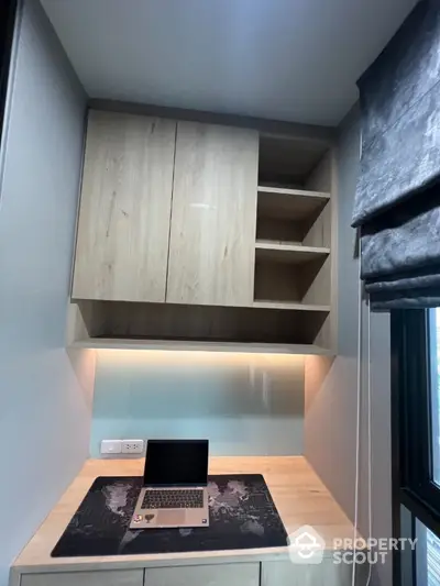 Modern study nook with wooden cabinets and natural light