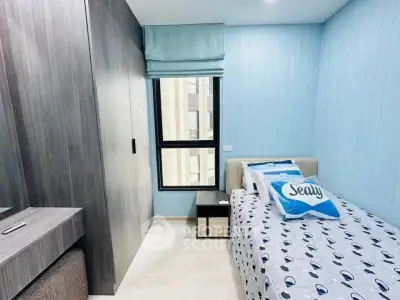 Cozy bedroom with modern decor and ample natural light