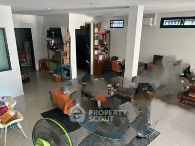 Spacious living room with modern decor and ample natural light, ideal for family gatherings.