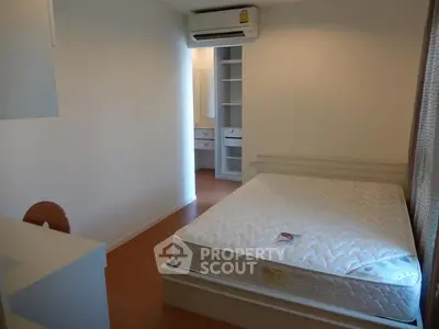 Cozy bedroom with air conditioning and ample storage space