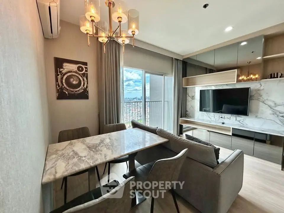 Modern living room with marble dining table and city view from balcony.