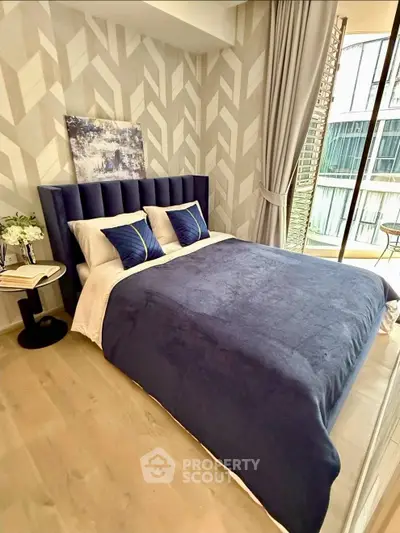 Luxurious bedroom with modern decor and large window offering natural light and city view.