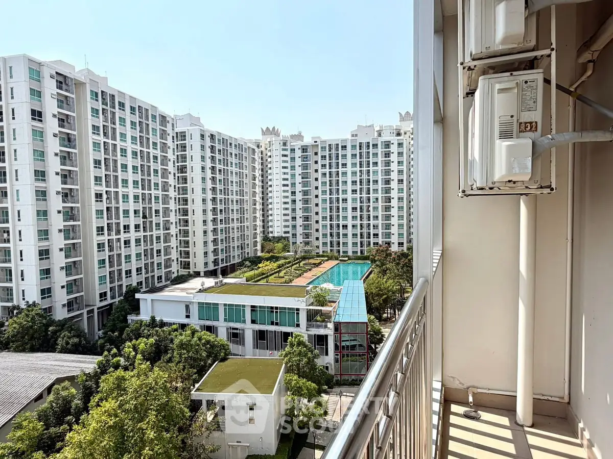 Stunning high-rise apartment view with lush garden and pool amenities