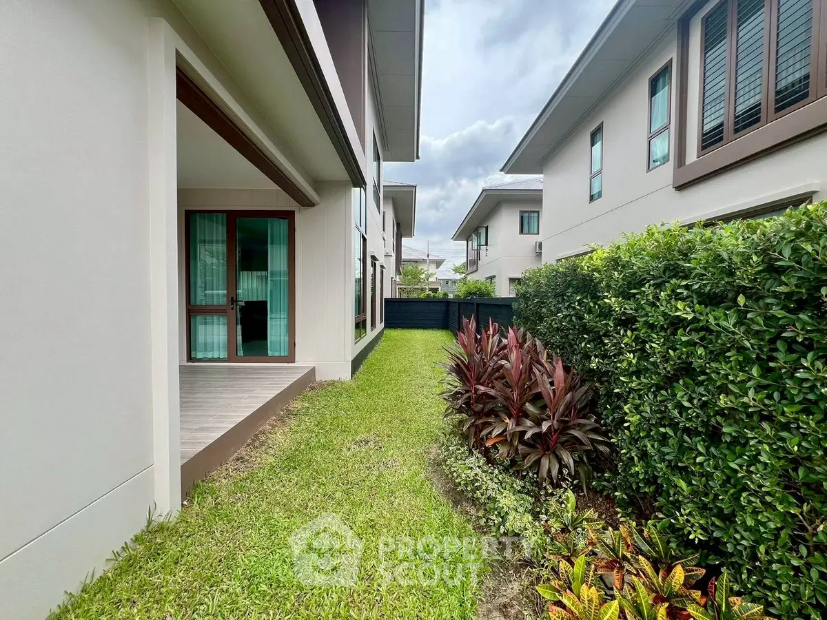 Charming residential garden with lush greenery and modern architecture