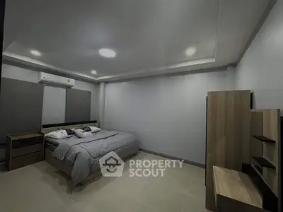 Spacious modern bedroom with minimalist design and cozy ambiance