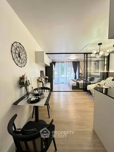 Modern open-plan living space with stylish decor and natural light
