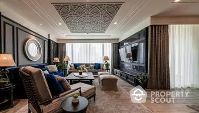 Luxurious living room with elegant decor and stylish furniture, featuring a sophisticated ceiling design.