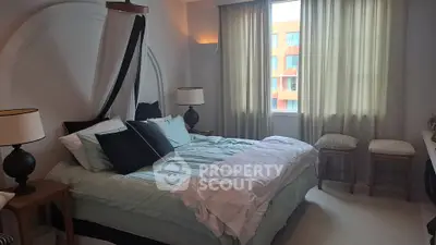 Elegant bedroom with canopy bed and soft lighting in modern apartment