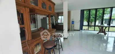 Spacious living room with elegant wooden bar and garden view