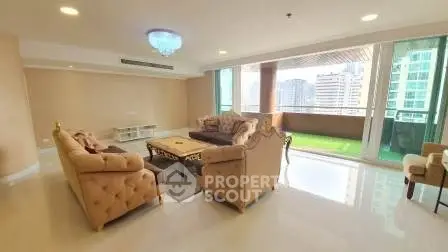 Luxurious living room with elegant furniture and city view balcony in high-rise apartment.