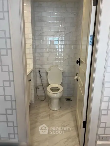 Modern bathroom with elegant tile design and sleek fixtures