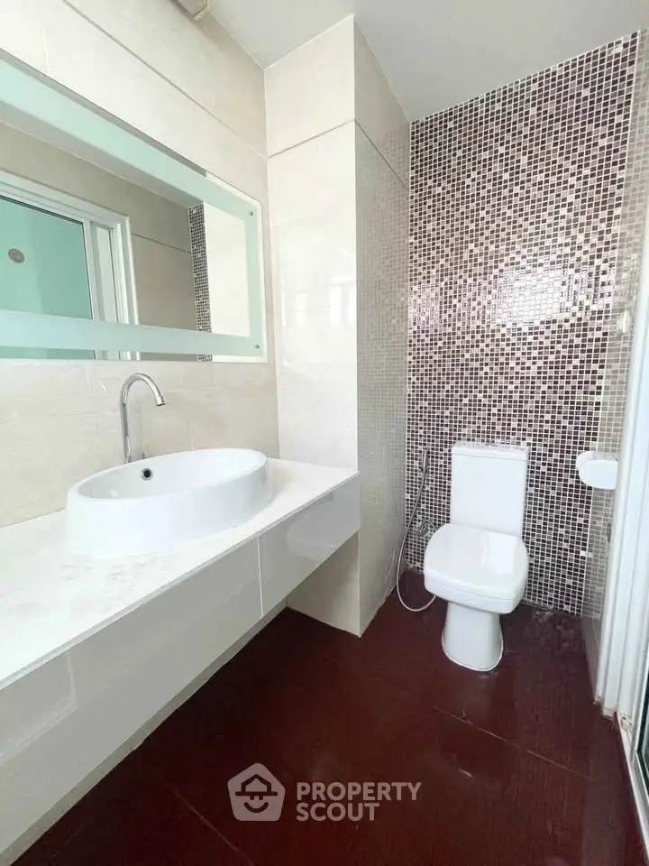 Modern bathroom with stylish mosaic tiles and sleek fixtures